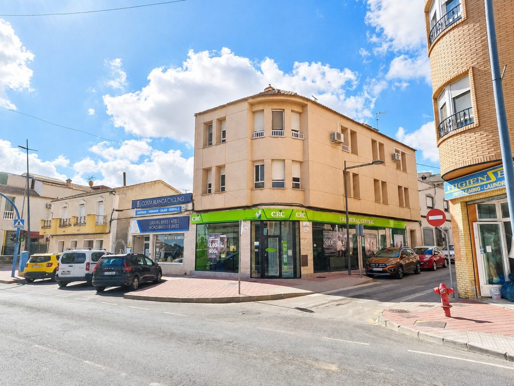 Renovated 2-bedroom top-floor apartment in Algorfa village centre with communal roof terrace and village views