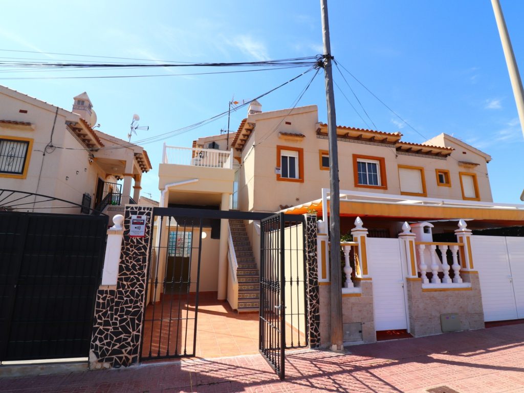Top-floor 2-bedroom apartment with glazed terrace and tiled garden in Punta Prima, Orihuela Costa