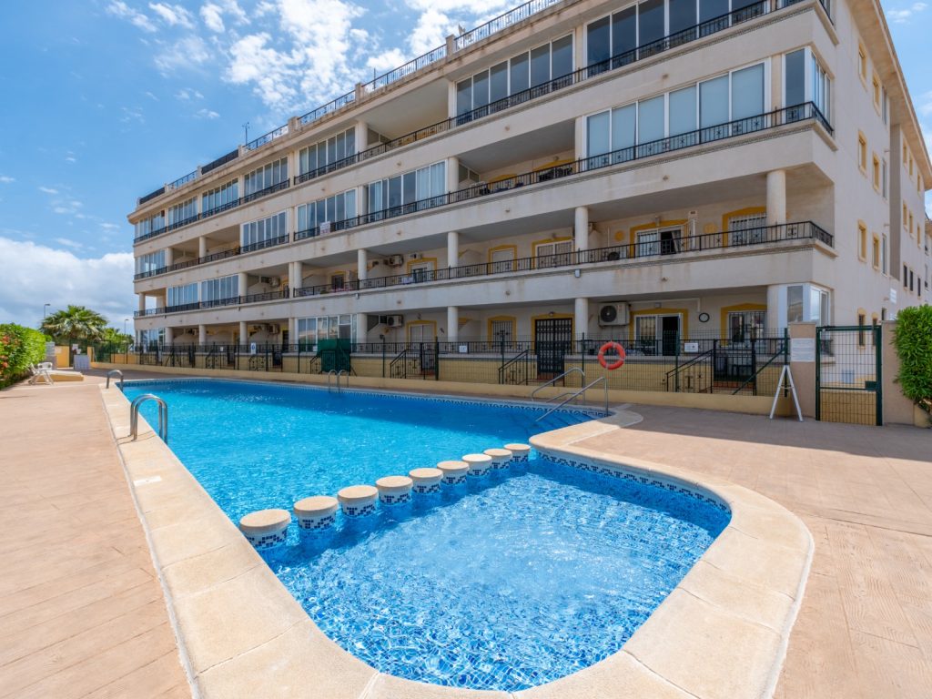 Modern 2-bedroom ground-floor apartment with glazed terrace and communal pool in Orihuela Costa, Alicante